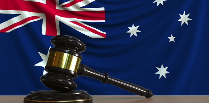 Judges gavel and block against the flag of Australia