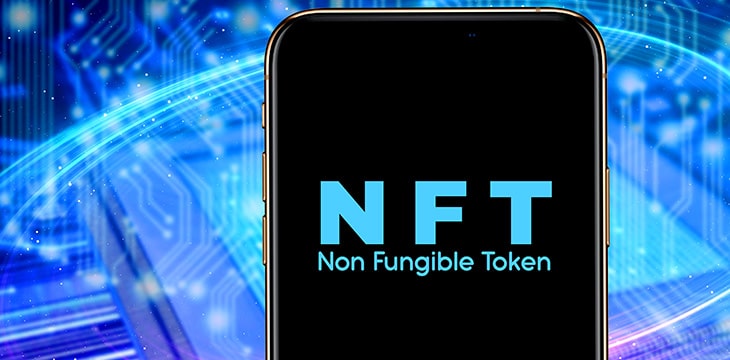 Smartphone with the acronym NFT logo