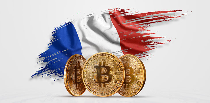 Crypto currency, gold coin BITCOIN BTC. Coin bitcoin against the background of the flag of France