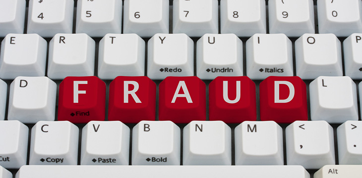 Fraud word on red keycaps keyboard