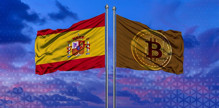 Spain flag and Bitcoin Flag waving over blue sky