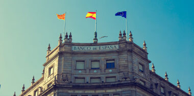 Bank of Spain building with flags