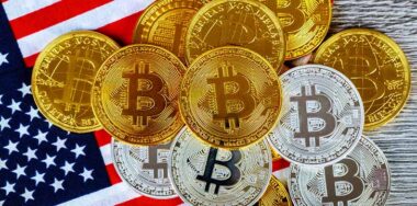 Bitcoins on top of American Flag