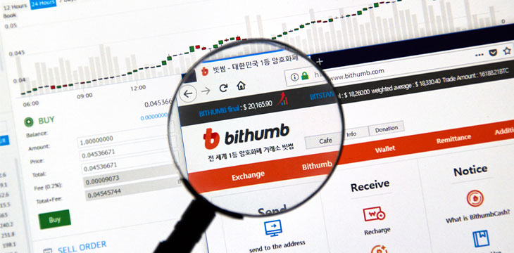 Bithumb cryptocurrency exchange website under magnifying glass