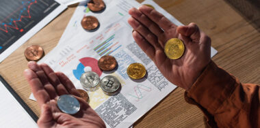 Hands holding bitcoins