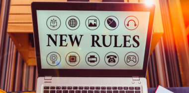 laptop screen with New Rules written