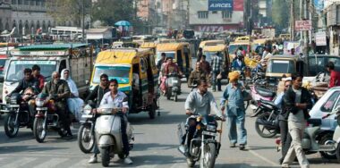 Traffic of people, cars and motorbikes in the street of New Delhi, India