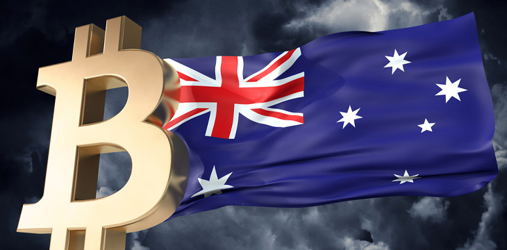 Gold Bitcoin cryptocurrency and waving Australia flag