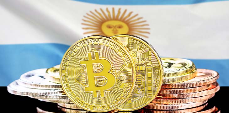 Bitcoins in front of flag of Argentina