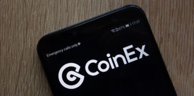 CoinEx cryptocurrency exchange website displayed on a modern smartphone