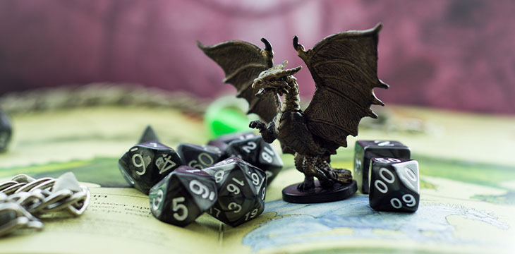 Dungeons and Dragons Colored dice and statue