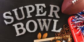 Super Bowl banner with football and beads