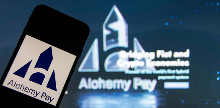 phone with Alchemy Pay logo
