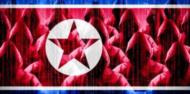 Anonymous hooded hackers with flag of North Korea overlay and binary code