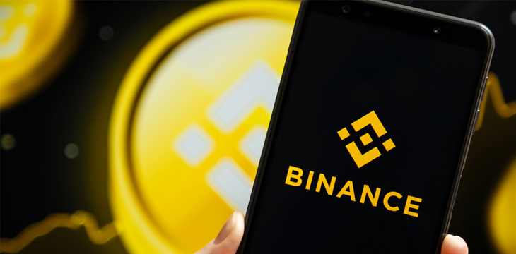 Binance logo displays on a mobile phone screen