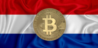 Gold bitcoin with flag background