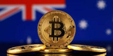 Stack of gold bitcoins with Australia flag background
