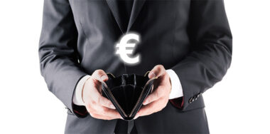 Businessman holding an empty leather wallet with euro sign above