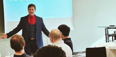 Dr. Craig Wright on the Bitcoin Masterclass speaking in front of a crowd