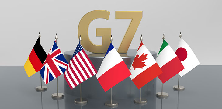 G7 on podium with flags surrounding it below