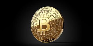 Golden Bitcoin Satoshi Vision (Bitcoin SV or BSV) cryptocurrency physical concept coin isolated on black background