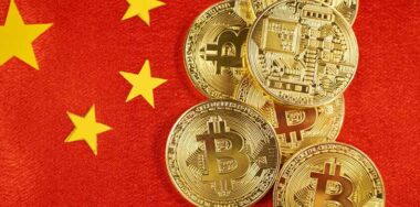 Golden bitcoin and Chinese flag on background
