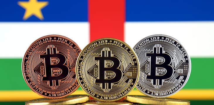 Physical version of Bitcoin (BTC) and Central African Republic Flag.