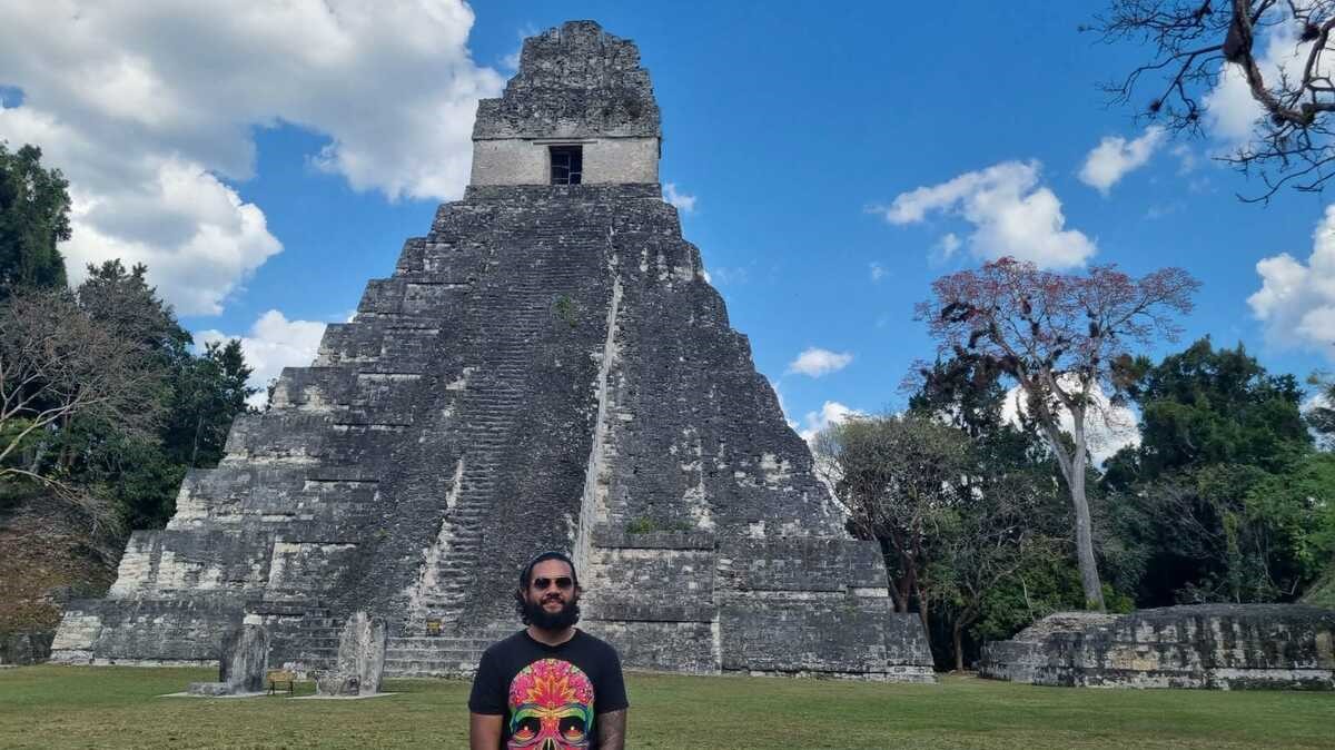 George Samuels in front of Tikal Guatemala pyramid
