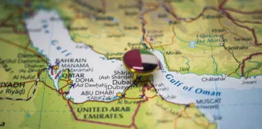 Dubai pinned on a map with the flag of United Arab Emirates