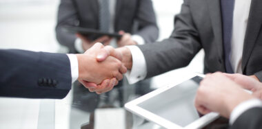Men shaking hands at the office