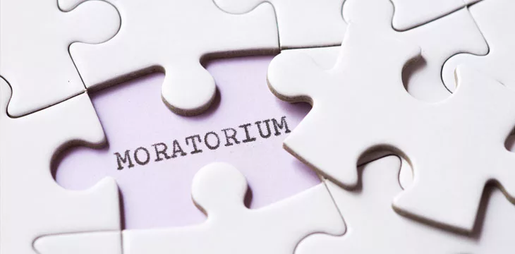 Moratorium word written with a typewriter with jigsaw puzzles
