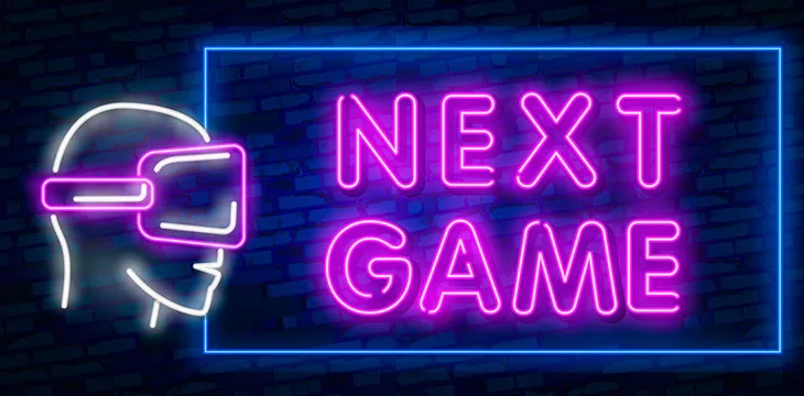 Technology and entertainment concept. Next game, over neon text with controller