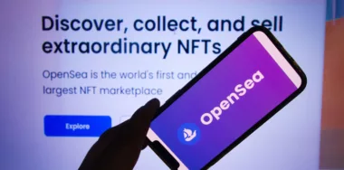 OpenSea NFT marketplace logo displayed on mobile phone