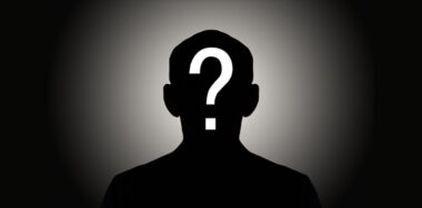 Silhouette male on gradient background with white question mark
