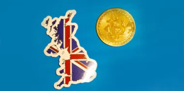 UK Flag with Bitcoin flat lay for illustration