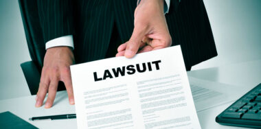 businessman giving a lawsuit