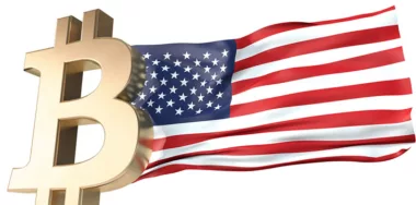 gold Bitcoin sign and US flag
