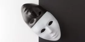 Black and white masks placed diagonally on contrasting background