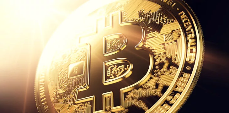 3D rendering of a Bitcoin in blurry close-up shot