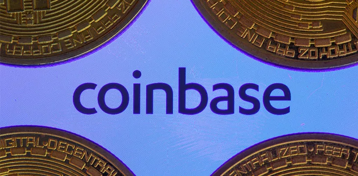 Four Bitcoins around Coinbase logo with gradient blue background