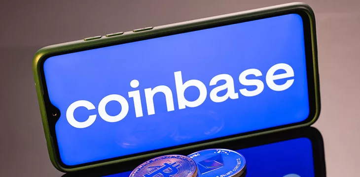 Coinbase, is an American company that operates a cryptocurrency exchange platform. Ethereum coin and Bitcoin on the background of the coinbase inscription.