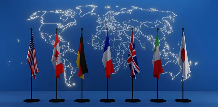 Flags of members of G7 group with background of world map