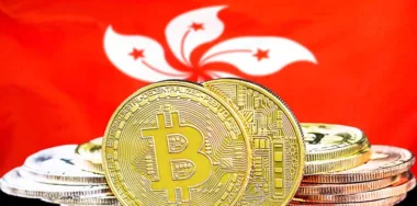 Bitcoins on Hong Kong flag background