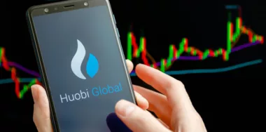 Huobi Global logo on mobile display