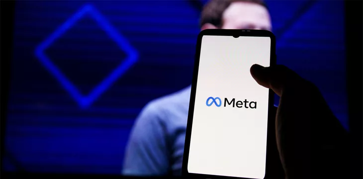 Meta logo on screen and Mark Zuckerberg is a Chief Executive Officer of Metaverse in background