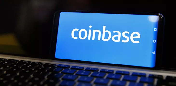 coinbase logo on smartphone with keyboard