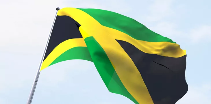 Jamaica flag flying on clear sky
