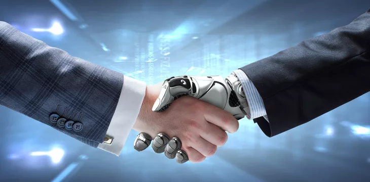 Human and Robot hands in handshake