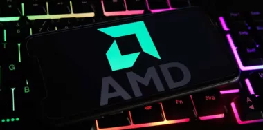 AMD logo on smartphone on top of a keyboard