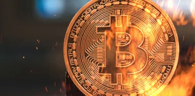 Bitcoin cryptocurrency money burning in flames and fire sparkles